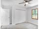 Neat and organized bedroom with ceiling fan, carpet, and built-in closet at 911 Oakland Sw Dr, Atlanta, GA 30310