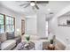 Bright living room features large windows, light colored walls, and wood-look floors at 911 Oakland Sw Dr, Atlanta, GA 30310