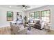 Bright living room features large windows, light colored walls, and wood-look floors at 911 Oakland Sw Dr, Atlanta, GA 30310