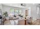Bright living room features large windows, light colored walls, and wood-look floors at 911 Oakland Sw Dr, Atlanta, GA 30310