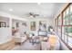 Bright living room features large windows, light colored walls, and wood-look floors at 911 Oakland Sw Dr, Atlanta, GA 30310