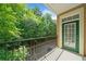 Balcony offering fresh air and views of the surrounding trees and a nearby parking area at 2303 Stratford Commons Commons, Decatur, GA 30033