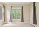 Bedroom featuring natural light from windows complemented by neutral-colored curtains at 2303 Stratford Commons Commons, Decatur, GA 30033