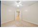 Bright bedroom featuring neutral walls, carpet, and ceiling fan with overhead light at 2303 Stratford Commons Commons, Decatur, GA 30033