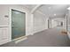 Hallway view with unit 2303 and sunflower welcome mat at 2303 Stratford Commons Commons, Decatur, GA 30033