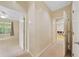 Hallway featuring doorways to various rooms, neutral-colored walls, and carpeted floor at 2303 Stratford Commons Commons, Decatur, GA 30033