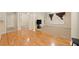 Spacious living room with hardwood floors that leads to carpeted sitting room at 2303 Stratford Commons Commons, Decatur, GA 30033