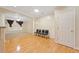 Living room with hardwood floors, arched doorway, and white trim at 2303 Stratford Commons Commons, Decatur, GA 30033