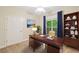 Home office featuring a desk, bookshelf, and large window with neutral decor at 2303 Stratford Commons Commons, Decatur, GA 30033