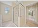Bathroom featuring glass enclosed walk-in shower and neutral-colored walls with tile floor at 2303 Stratford Commons Commons, Decatur, GA 30033