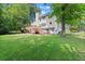 Spacious backyard with deck, patio, and mature trees at 4392 Windsor Oaks Cir, Marietta, GA 30066