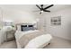 Bright bedroom features a ceiling fan, neutral carpet, and contemporary decor for a calming and inviting space at 4392 Windsor Oaks Cir, Marietta, GA 30066