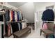 Walk-in closet with custom shelving and organization system for clothing and shoes at 4392 Windsor Oaks Cir, Marietta, GA 30066