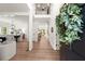 Stunning foyer with hardwood floors, a wreath on the front door, and an open view to the dining and living areas at 4392 Windsor Oaks Cir, Marietta, GA 30066
