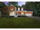 Beautiful brick home with manicured lawn and front porch at 4392 Windsor Oaks Cir, Marietta, GA 30066