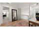 Hallway on second story with decorative rug and view into office and bedroom at 4392 Windsor Oaks Cir, Marietta, GA 30066