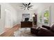 Bright home office with a large window, hardwood floors, and a comfortable sitting area at 4392 Windsor Oaks Cir, Marietta, GA 30066