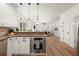 Bright kitchen with custom cabinets, stainless appliances, granite countertops, and hardwood flooring at 4392 Windsor Oaks Cir, Marietta, GA 30066