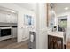Well-organized laundry room with modern washer and dryer, storage cabinets, and a convenient folding area at 4392 Windsor Oaks Cir, Marietta, GA 30066
