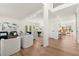 Bright living room featuring hardwood floors, white walls, and large windows for an open and airy feel at 4392 Windsor Oaks Cir, Marietta, GA 30066