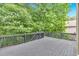 Spacious deck overlooking green trees offers privacy and outdoor enjoyment at 511 Millwood Ct, Canton, GA 30114