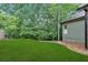 Large, well-maintained backyard with a lush lawn and established trees creates a tranquil outdoor setting at 511 Millwood Ct, Canton, GA 30114