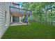 Multi-level deck with stairs to the yard and lower patio, blending seamless indoor-outdoor living with garden views at 511 Millwood Ct, Canton, GA 30114
