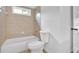 Clean bathroom with tub and shower combo, tiled surround, and white toilet at 511 Millwood Ct, Canton, GA 30114