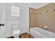 Bathroom featuring a vanity with granite counter, toilet, and shower/tub combo at 511 Millwood Ct, Canton, GA 30114
