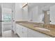 Bright bathroom with granite counters, double sinks, and updated fixtures at 511 Millwood Ct, Canton, GA 30114