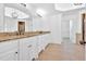 Modern bathroom with tiled floors, double sink vanity, and modern light fixture at 511 Millwood Ct, Canton, GA 30114