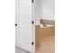 This bathroom shows a white door to a tiled tub with updated fixtures at 511 Millwood Ct, Canton, GA 30114