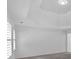 Bedroom featuring tray ceiling and neutral carpet at 511 Millwood Ct, Canton, GA 30114