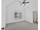 Bedroom featuring tray ceiling, neutral carpet, and natural light at 511 Millwood Ct, Canton, GA 30114
