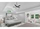This is a spacious main bedroom with plenty of natural light and a seating area at 511 Millwood Ct, Canton, GA 30114