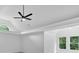 The bedroom has a dramatic tray ceiling and two large windows at 511 Millwood Ct, Canton, GA 30114