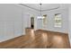 Elegant dining room with hardwood floors and wainscoting at 511 Millwood Ct, Canton, GA 30114
