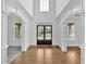 Elegant foyer with gleaming hardwood floors and arched doorways at 511 Millwood Ct, Canton, GA 30114