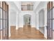 Grand foyer with hardwood floors, white trim, and a view of the staircase at 511 Millwood Ct, Canton, GA 30114