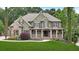 Charming two-story home with a covered porch and well-manicured lawn at 511 Millwood Ct, Canton, GA 30114