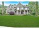 Beautiful front yard with a spacious lawn leading up to a well-maintained two-story house at 511 Millwood Ct, Canton, GA 30114