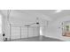 Well-lit two-car garage featuring a clean, white interior, an automatic door opener, and an entry door to the home at 511 Millwood Ct, Canton, GA 30114