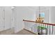 This hallway features updated lighting and a gorgeous banister at 511 Millwood Ct, Canton, GA 30114