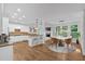 Open concept kitchen and breakfast nook, with hardwood floors and lots of natural light at 511 Millwood Ct, Canton, GA 30114