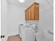 This laundry room includes lots of cabinet space and a utility sink at 511 Millwood Ct, Canton, GA 30114