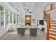 The living room features lots of natural light, a fireplace and coffered ceiling at 511 Millwood Ct, Canton, GA 30114