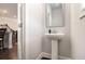 Pedestal sink with a mirror in a half-bath at 2700 Norwich Trce, Snellville, GA 30078