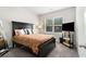 Carpeted bedroom with a large bed, a window, and a TV on a stand at 2700 Norwich Trce, Snellville, GA 30078