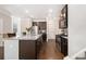 Stylish kitchen with a central island, granite countertops, and stainless steel appliances at 2700 Norwich Trce, Snellville, GA 30078