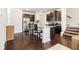 Bright kitchen features granite countertops, stainless steel appliances, and dark wood cabinets at 2700 Norwich Trce, Snellville, GA 30078
